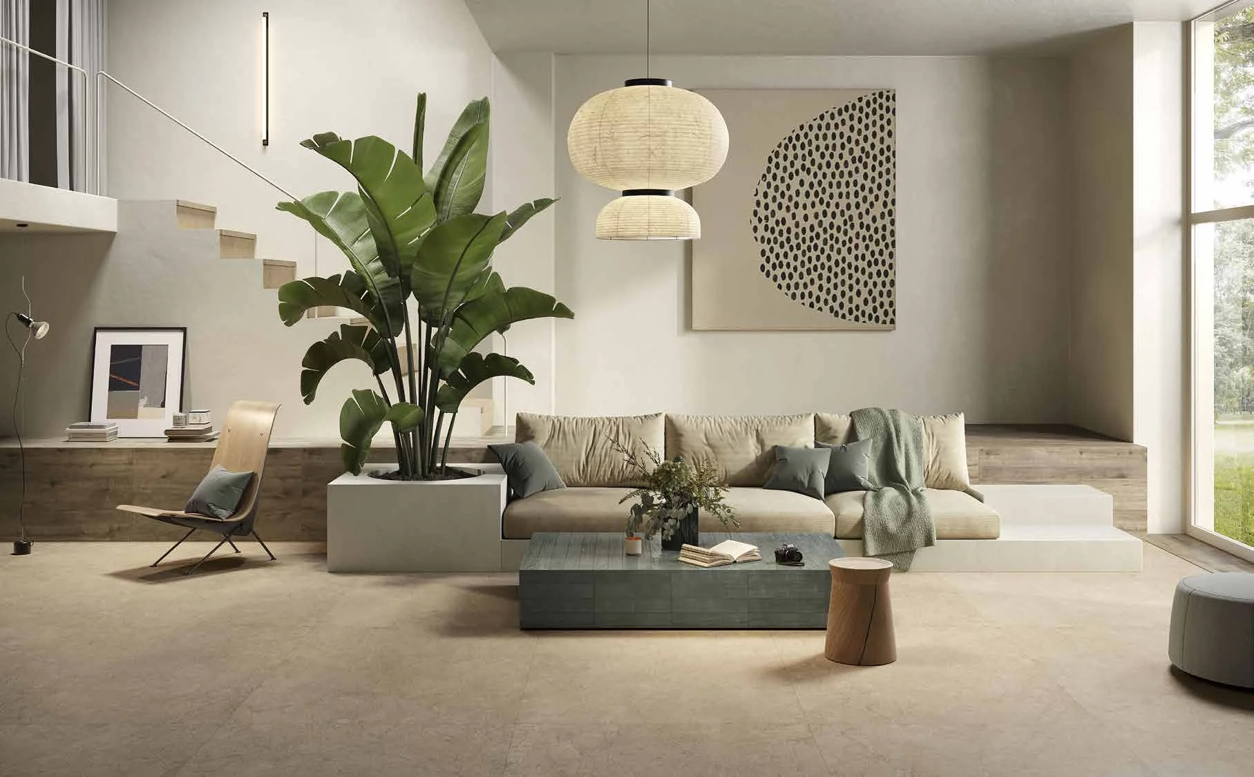 Beige flooring in the living room. ARKÈ Tortora and COLORFUL Cotton form the furnishing surfaces; the table is faced in COLORFUL Pine Green Brick.
