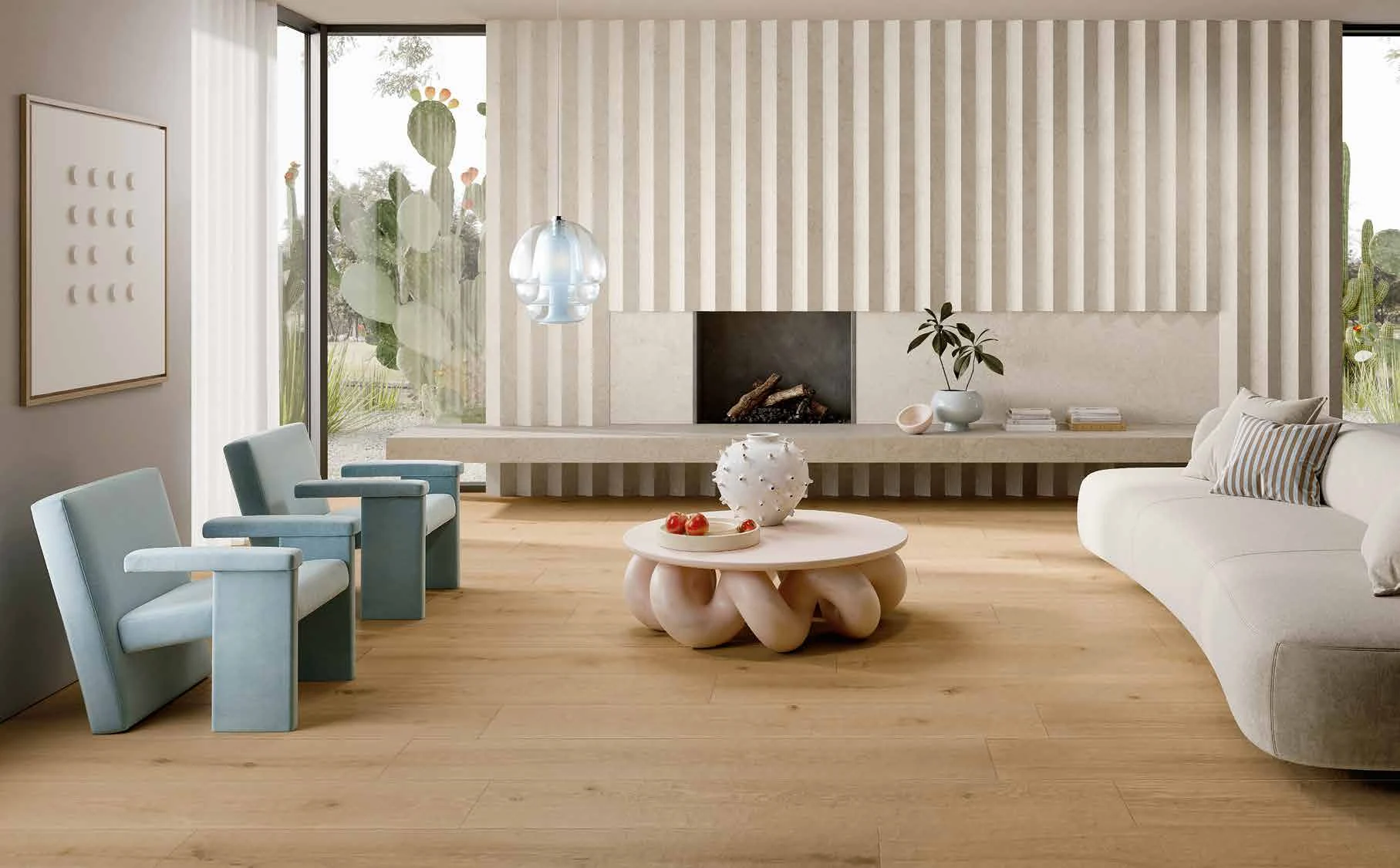 Rovere dei Medici long-plank flooring in the living room. The walls and furnishing surfaces are COCOONING Cotton and Alpaca.