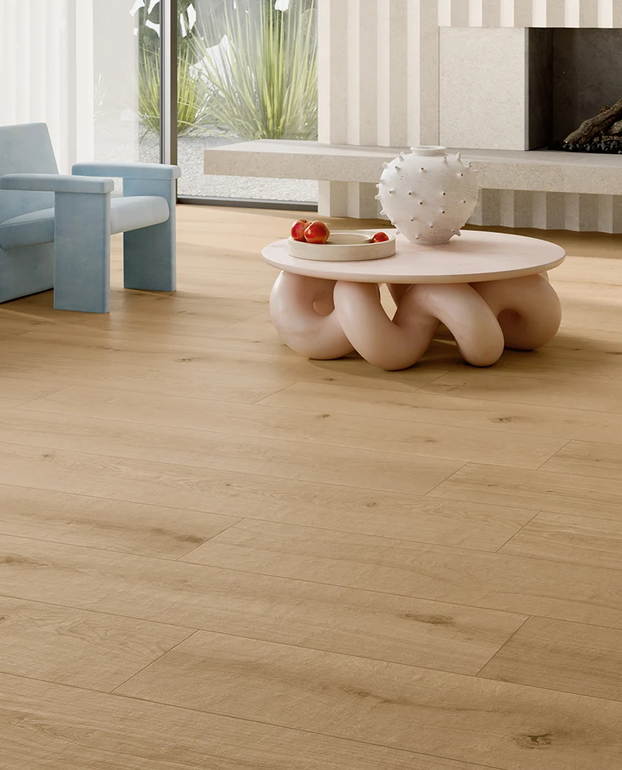 Rovere dei Medici long-plank floor beside the blue armchair and coffee table.
